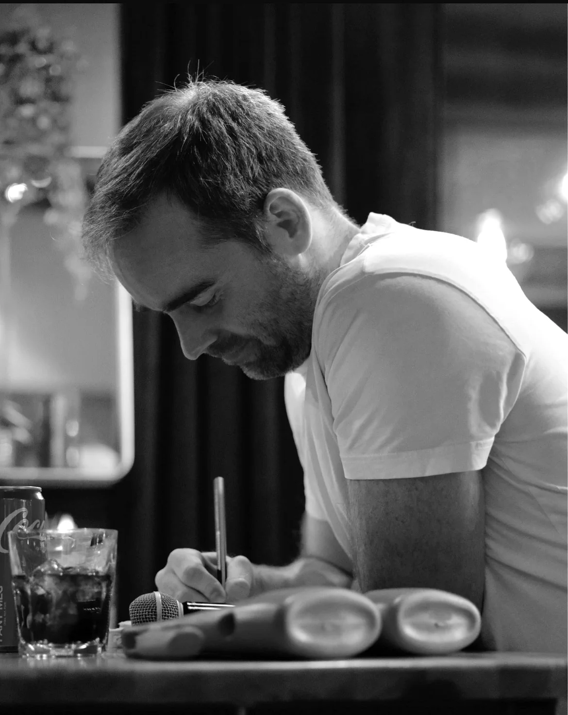 Eirik writing notes at a table